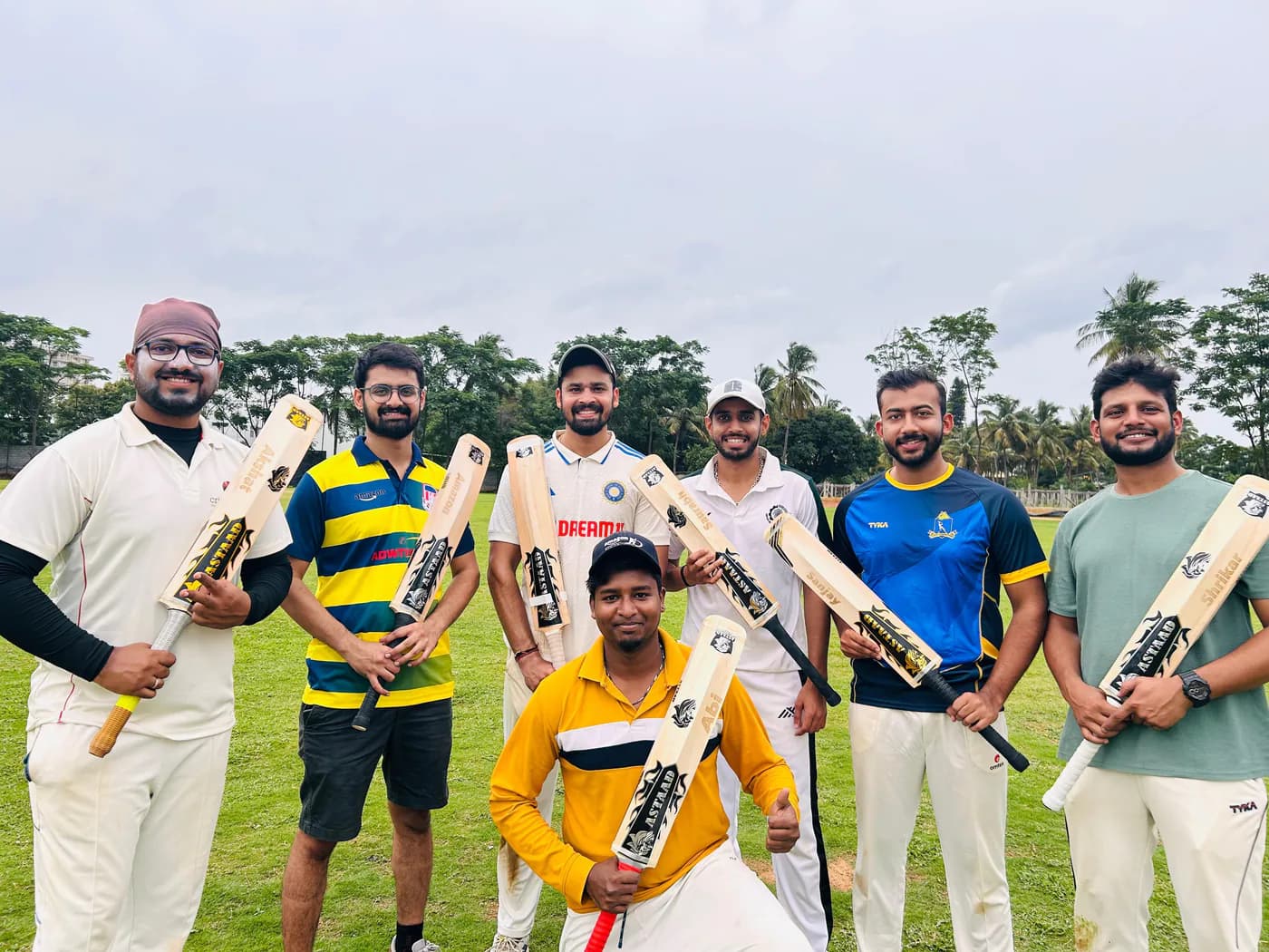 A team of players holding their Astaad bats