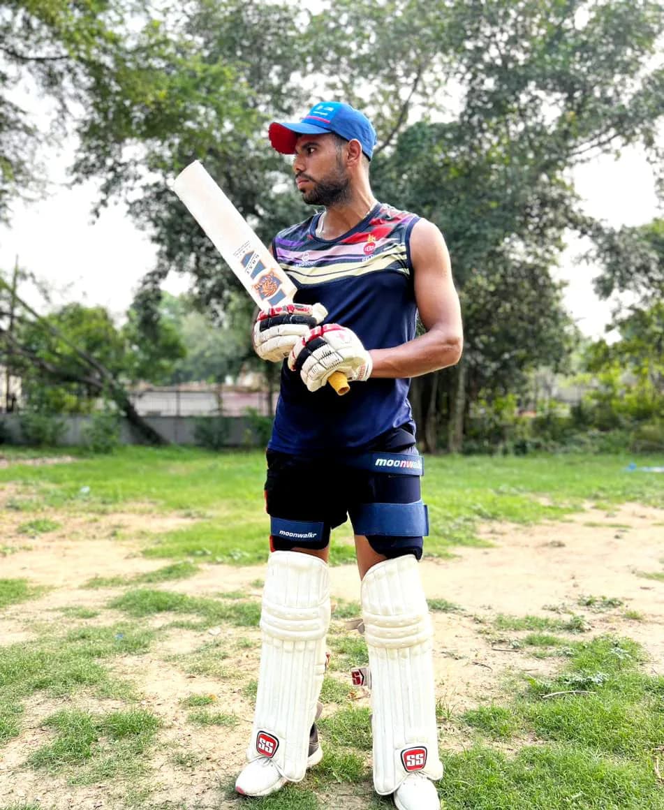 A batter padded up with an Astaad bat