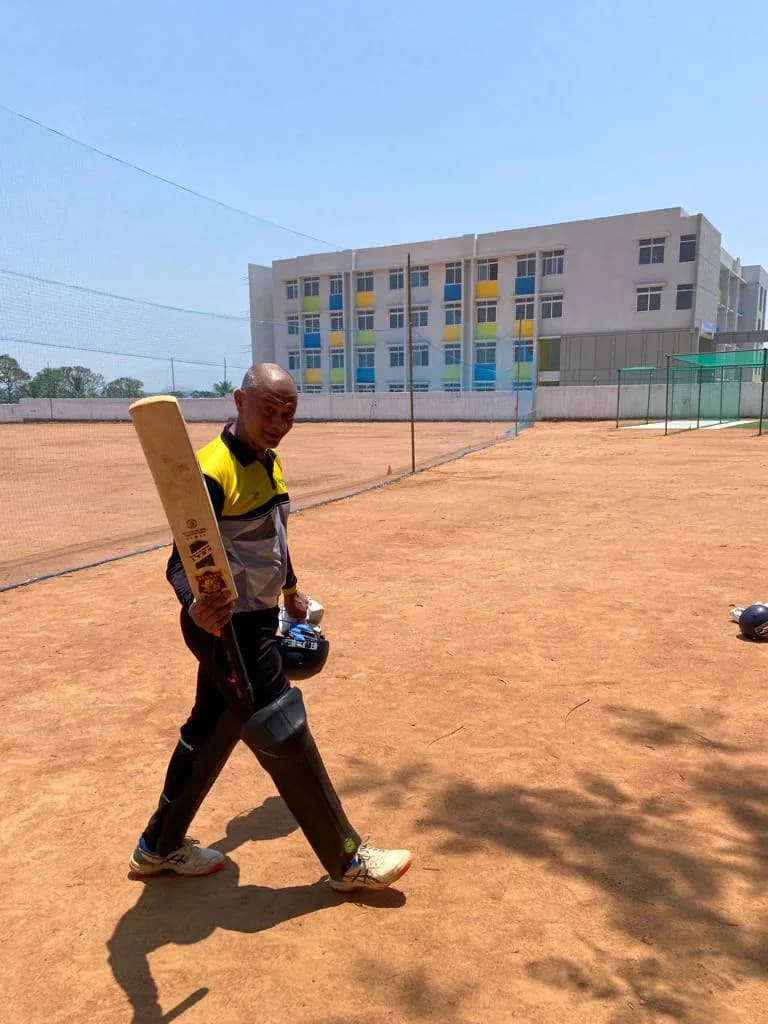 A player walking out with an Astaad bat