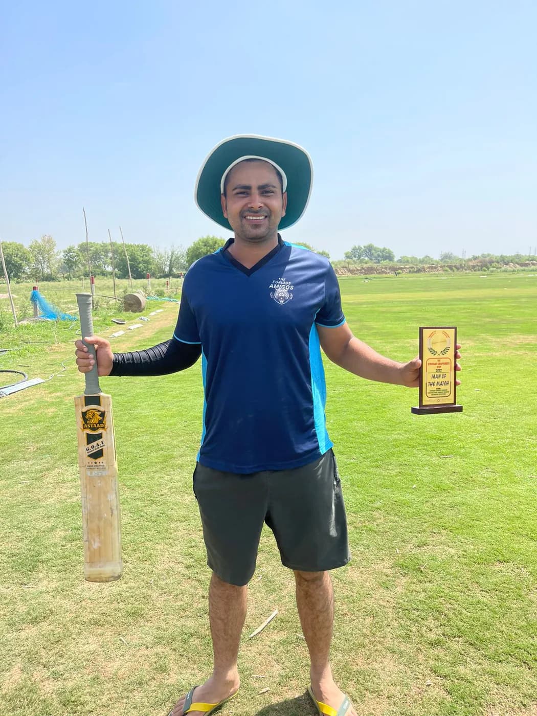 A player with an Astaad bat and a trophy
